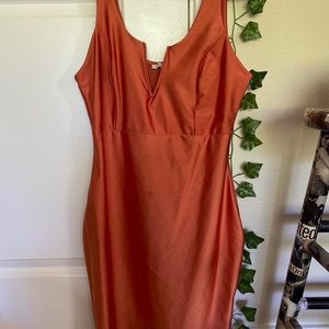 orange 70’s style body con dress